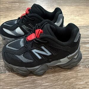 New Balance Kids Black and Gray Sneakers with Red Accents